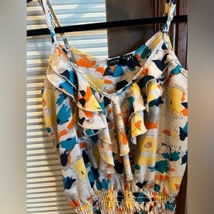 Adorable multiple colored floral tank. Bunched at bottom and so flattering.